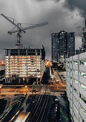 City skyscraper being build night time shot