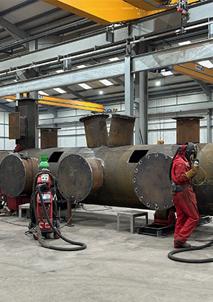 Welder welding on a pipeline