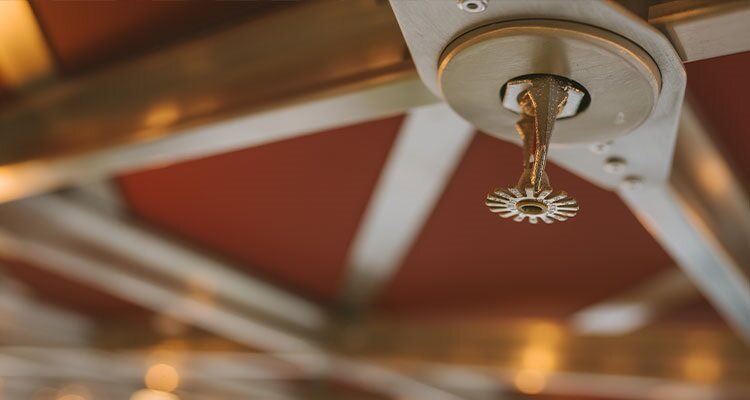 Overhead fire suppression sprinkler