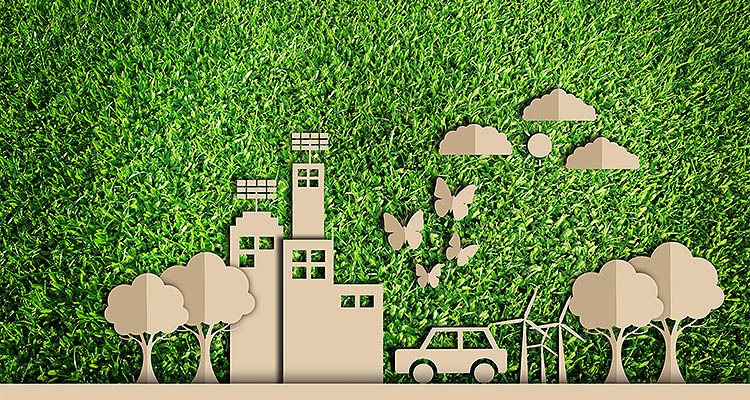 Paper cut of Green city concept on green grass