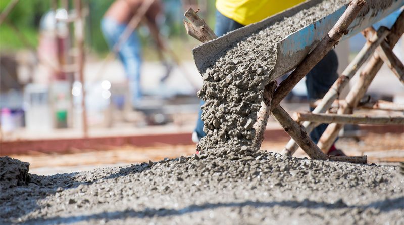 Image of cement being poured into the floor to support sustainable cement article