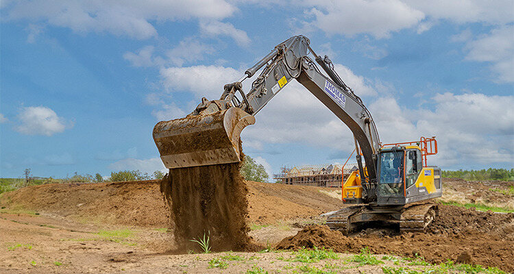 Excavator moving soil